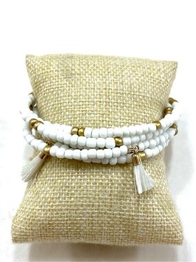 White & Gold Beaded Coil Bracelet with Tassel Detail